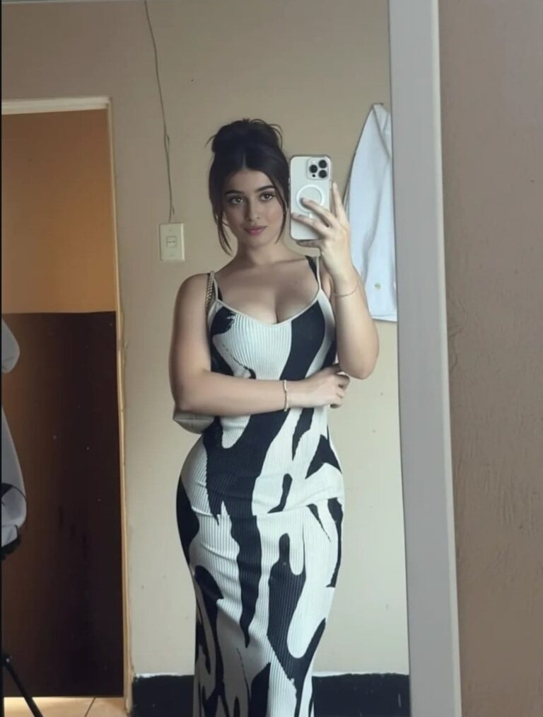 Woman taking mirror selfie