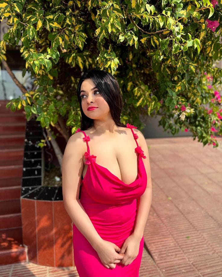 Stylish woman posing in Red Dress outside