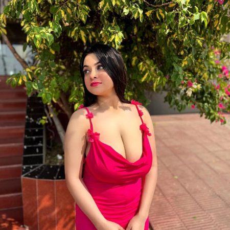 Stylish woman posing in Red Dress outside